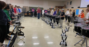 GMS Percussion Students Play With GHS Marching Band Drumline