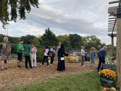 Guests visited and enjoyed the garden snacks prepared and served by culinary students.