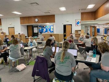 School staff meet in teams to review data