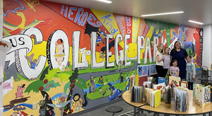 Photo of College Park Mural with Ms. Burroughs and her family