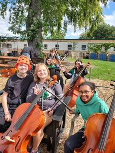 Orchestra Enjoys Practices Outside in School Garden