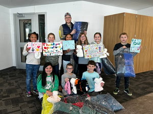 Students Accept Generous Donation of Warm Winter Wear for Those in Need