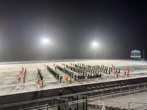 Marching Band Heads to Snowy Field to Tape a Segment for Local Holiday Special