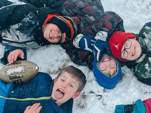 Students Enjoy a Snow-Covered Playground