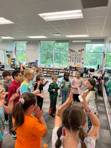 Students smiling playing classroom meeting game