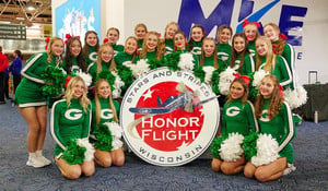 Cheer Team Welcomes Veterans Returning From Honor Flight