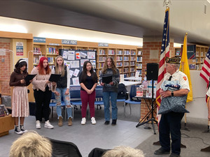 Choir Members Sing at Ceremony for Veterans