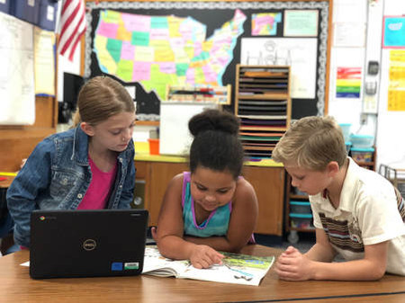 students reading a book