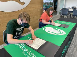 Students Signing Pledge to Prosper Certificates